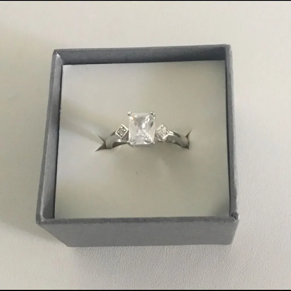 1.8 Ct. Emerald Cut Simulated Diamond Bridal Ring